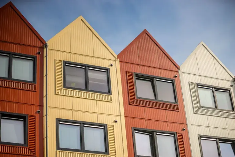 Vibrant apartment facades with distinct designs and colors. Stock Photo