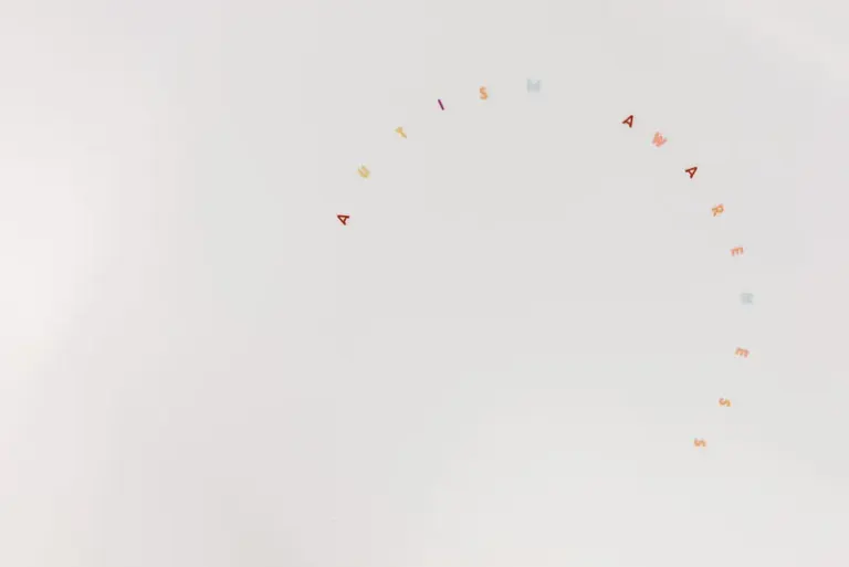 Minimalist design featuring autism awareness lettering on a clean white background. Stock Photo