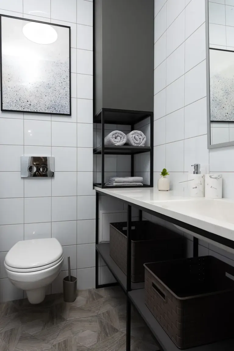A stylish minimalist bathroom with sleek fixtures and organized storage. Stock Photo